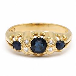 Gold sapphire and diamond ring, three round cut sapphires spaced by four single cut diamon...