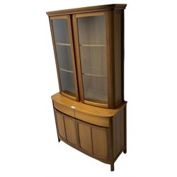 Nathan - teak wall display unit, raised display cabinet enclosed by two glazed doors, the lower section fitted with two drawers and double panelled cupboard 