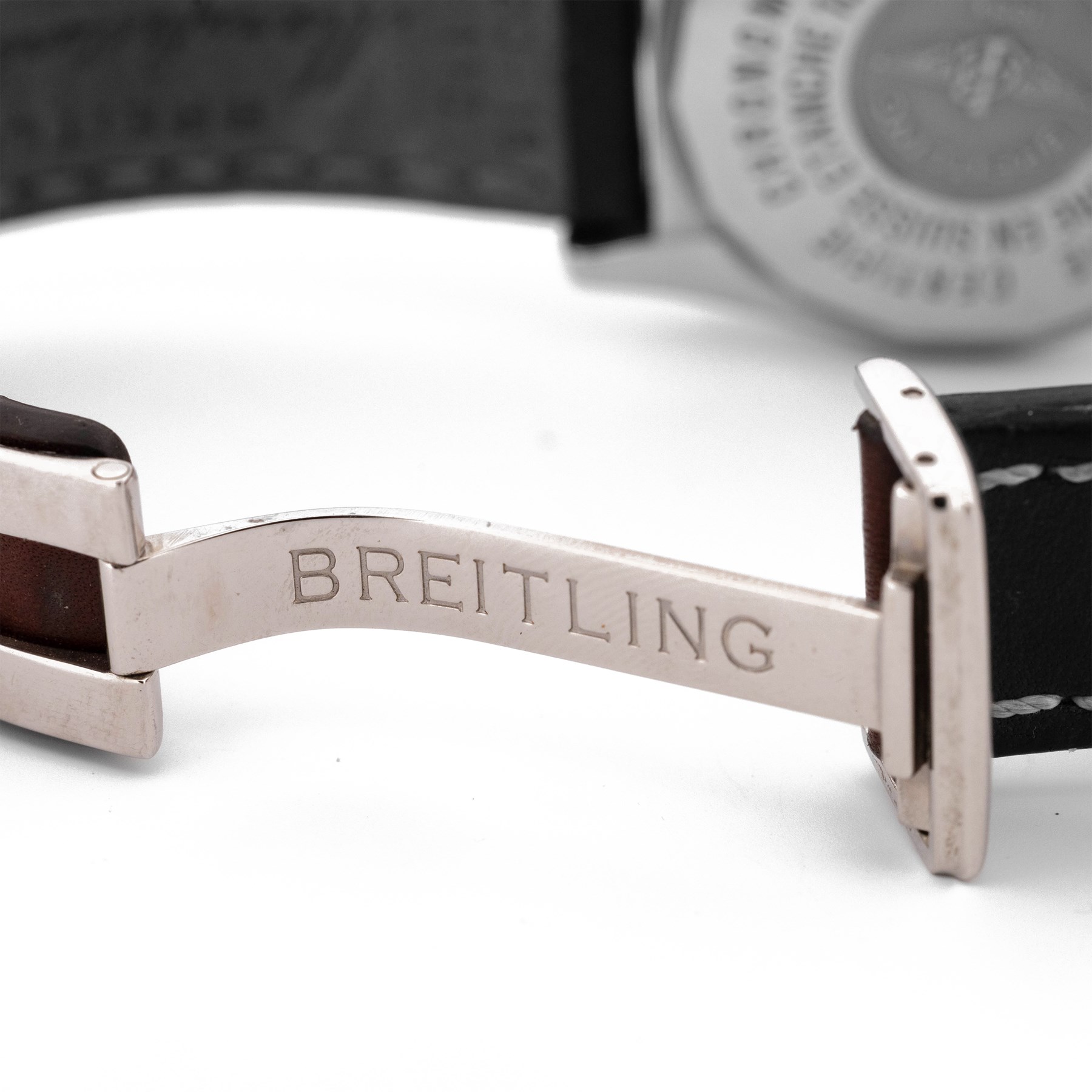 Breitling Chrono Cockpit gentleman's stainless steel diamond set automatic wristwatch, Ref. A13357, serial No. 2084732, cream dial with Roman numeral hour markers and date aperture, diamond set unidirectional rotating bezel, on Breitling brown leather strap, with fold-over clasp