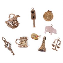 18ct gold charm, five 9ct gold charms including ewer, enamelled mug, scales, jockey hat an...