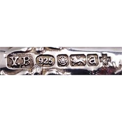 Group of silver, comprising modern silver handled letter opener, the handle decorated in low relief with Oriental scene set with pagodas, bridge and boat, hallmarked Yates Brothers, Sheffield 2000, a 1920's silver handled letter opener, hallmarked Sheffield 1928, makers mark GB, and a further silver handled letter opener, hallmarks worn and indistinct, probably Edwardian, a 20th century sauce ladle, probably American, with part fluted bowl and foliate detail to terminal, marked Sterling, an American silver spoon marked Sterling and marked for Gorham,1930's caddy spoon, an Edwardian silver handled pickle spoon, and four napkin rings, various hallmarks, dates ranging 1906 to 1924, approximate total gross weight 8.19 ozt (254.8 grams)