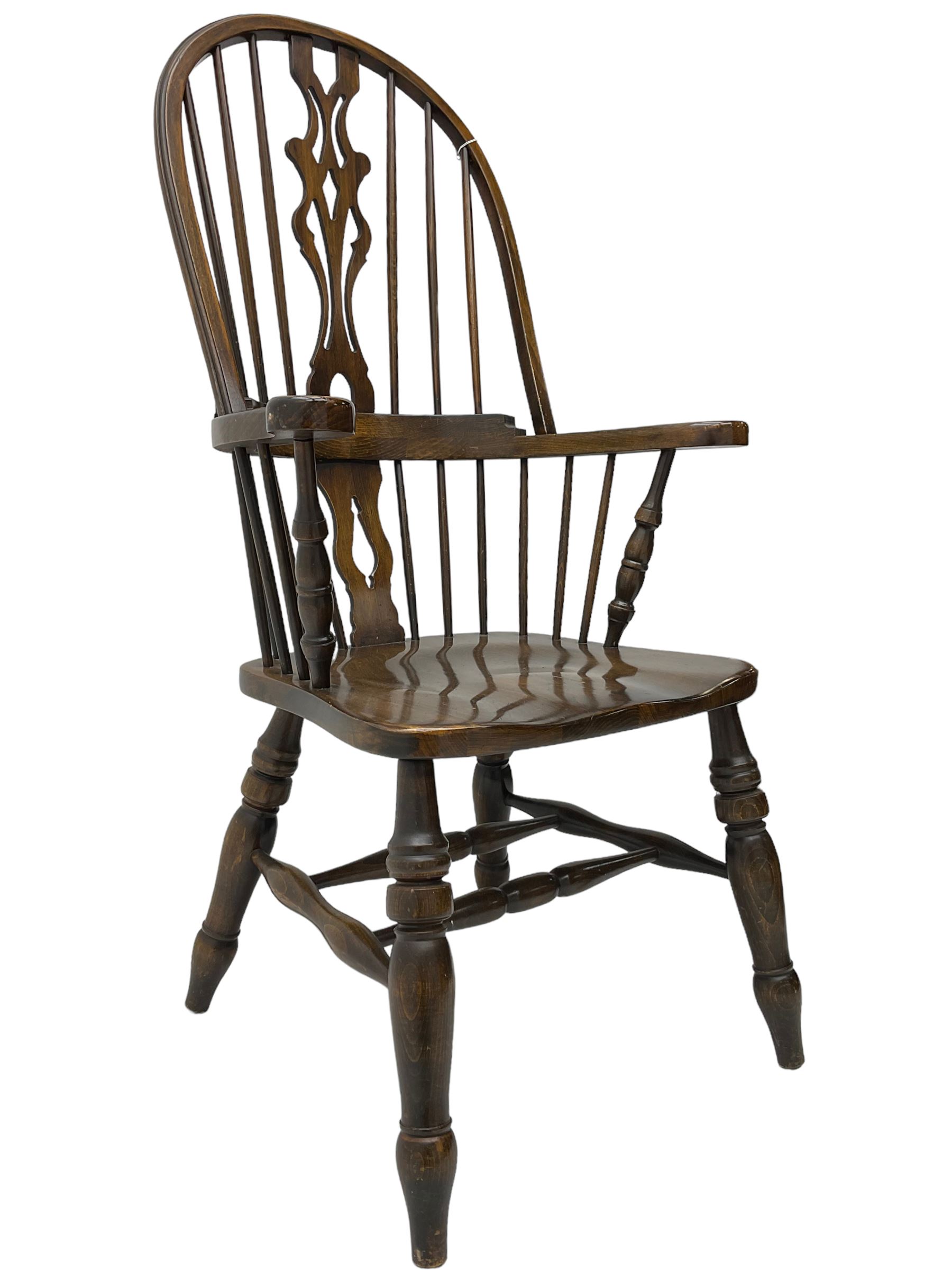 Stained beech Windsor armchair, double hoop and stick back with shaped and pieced splat back, on turned supports united by double swell-turned H stretchers