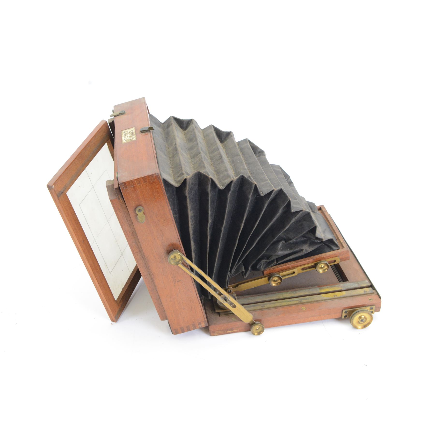 UNABLE TO SELL Two mahogany and brass half plate cameras, comprising E & T Underwood camera and a Taylor's Drug Co. Ltd 'The Albion' camera, each with Thornton Pickard 'Snap Shot' lenses, all with ivory maker's plaques, with a glass plate and a canvas carry case