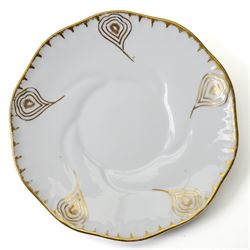 Early 20th century Sarreguemines tea wares, decorated with peacock feathers in gilt, comprising six teacups, eight saucers and eight side plates