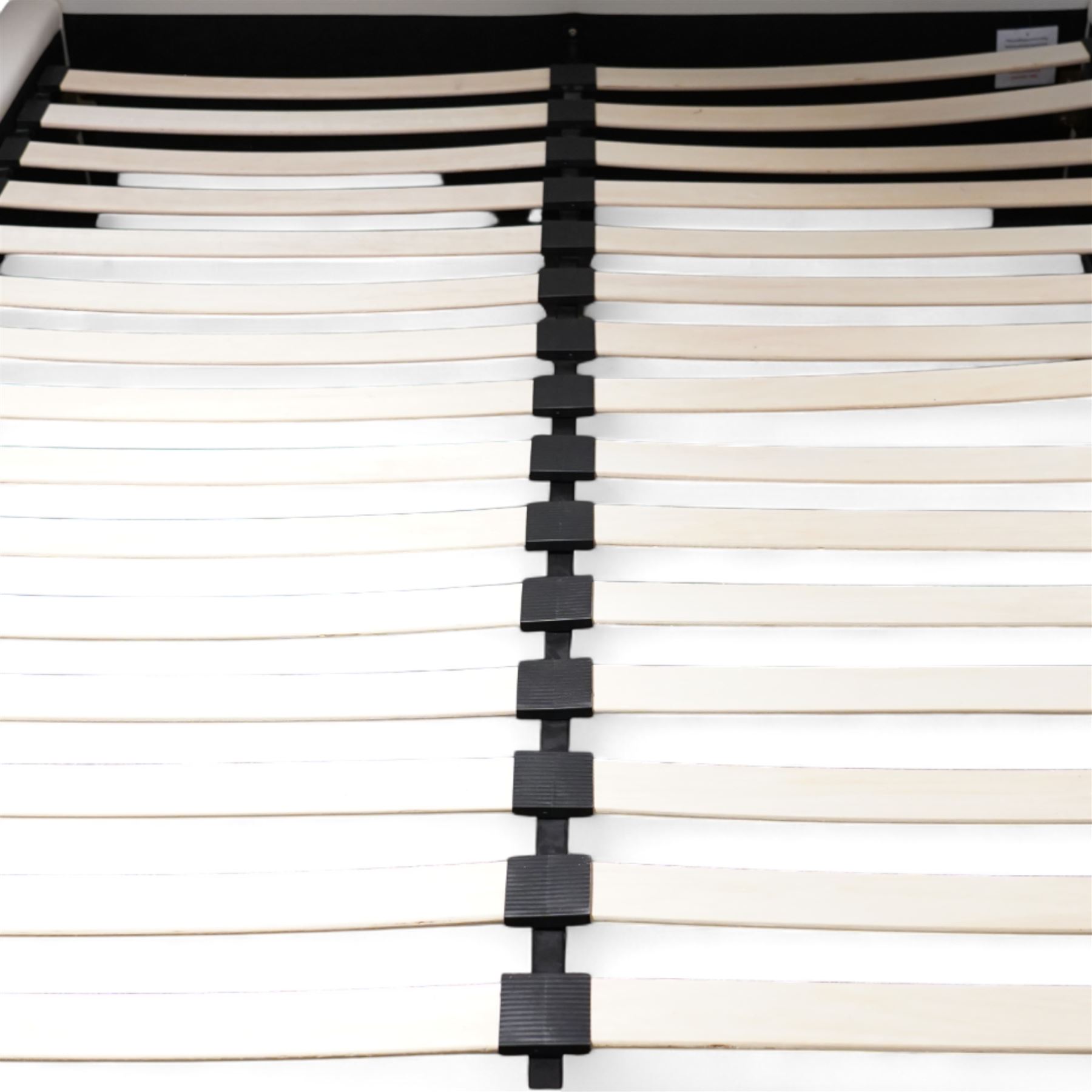 Contemporary upholstered double size bed frame, plain rectangular headboard and footboard upholstered in cream faux leather, sprung beech slatted base raised on concealed feet