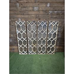 Four 19th century cast iron windows, lattice glazed in white painted finish, 
