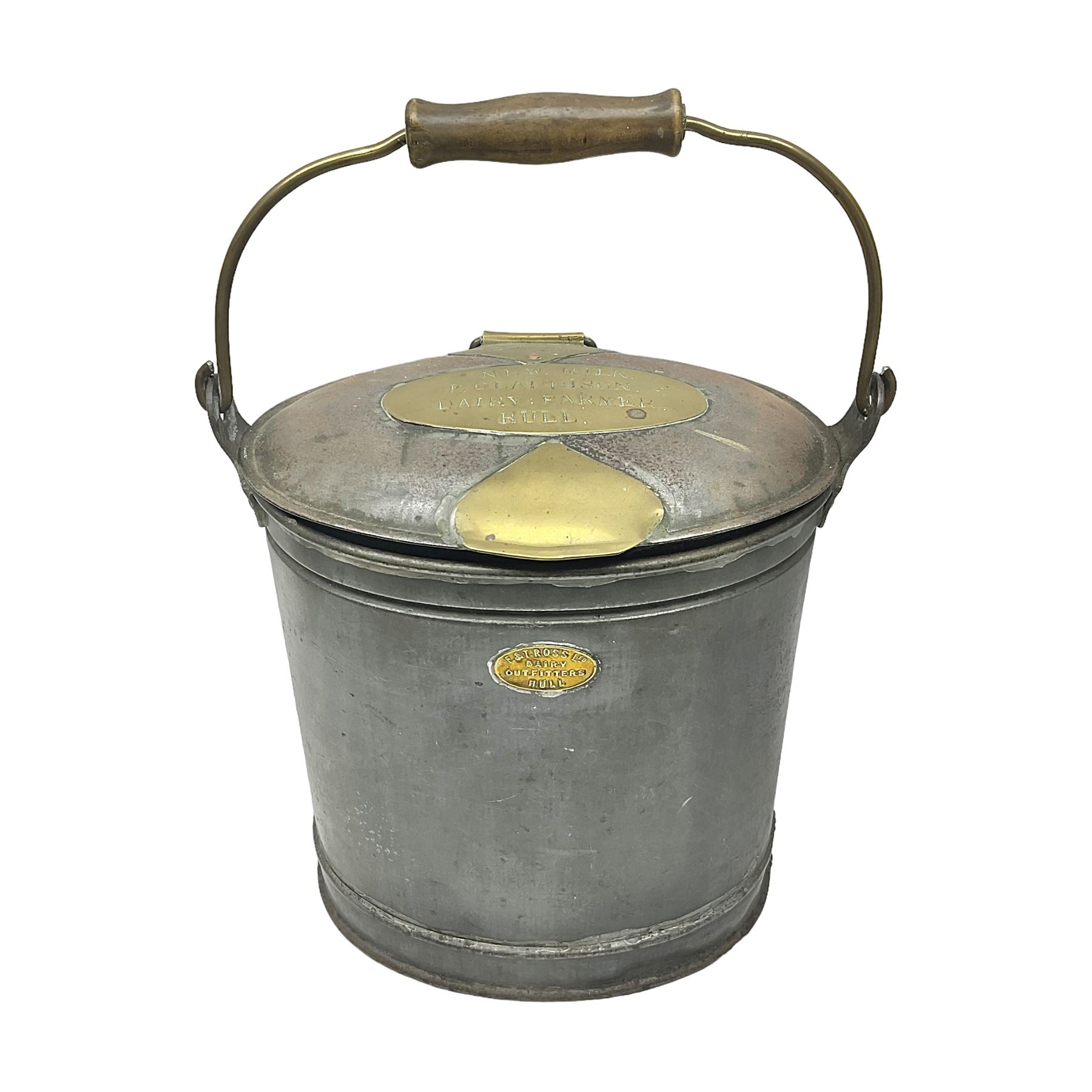 Late 19th/early 20th century steel and brass dairy pail or can, of oval form with swing handle, brass plaque to front and hinged cover inscribed 'F & T Ross Ltd Dairy Outfitters Hull', and 'New Milk F Clappison Dairy Farmer Hull', not including handle H30cm