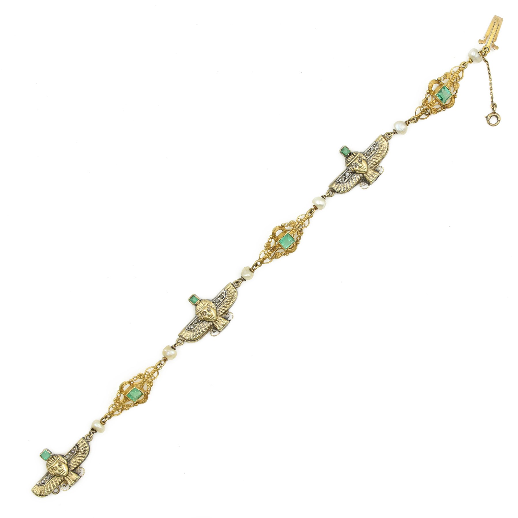 Early 20th century French 18ct gold Egyptian Revival bracelet, three winged sphinx motif panels, each set with a square cut emerald and four rose cut diamonds, spaced by six white / cream pearls and three scrolling openwork links, each centred with a square cut emerald, French assay marks