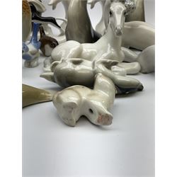 A collection of Russian animal figures, largely comprising Lomonosov examples, to include examples modelled as otters, seals, polar bears, horse, various birds, wolf, hedgehog, etc. 