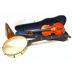  A cased Stentor Student violin and bow, together with a J E Dallas banjo with inlaid mother of pearl star and disc marker detail to neck, (a/f), and a wooden cased metronome.   