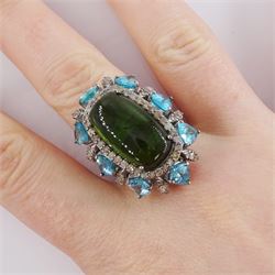 Silver tourmaline, diamond and apatite dress ring, the central cabochon green tourmaline, with round brilliant cut diamond and pear cut apatite surround, tourmaline approx 9.75 carat, total diamond weight approx 0.95 carat total apatite weight approx 5.10 carat