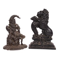 Victorian cast iron doorstop in the form of a rampant lion on a plinth base, together with cast iron Mr Punch doorstop, lion H39cm