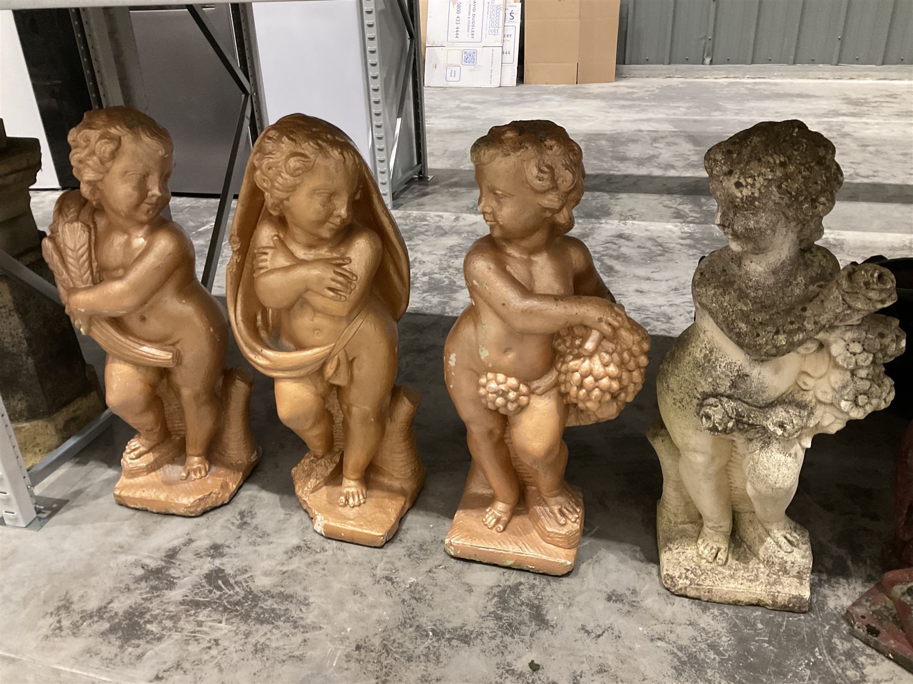 Set of four representations of the seasons in the form of putti - THIS LOT IS TO BE COLLECTED BY APPOINTMENT FROM DUGGLEBY STORAGE, GREAT HILL, EASTFIELD, SCARBOROUGH, YO11 3TX