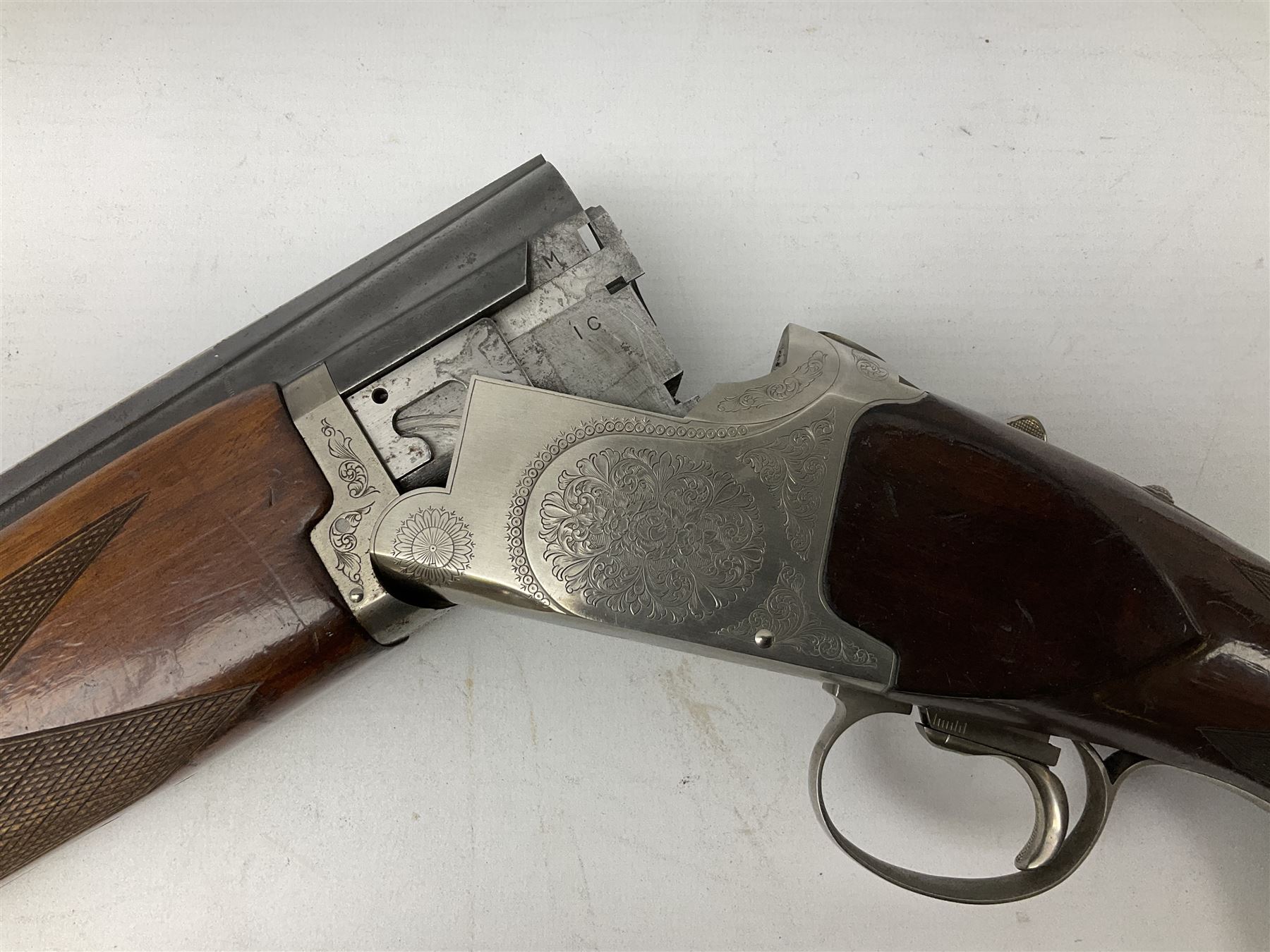 Winchester Japan 5500 12-bore by two-and-three quarters over-and-under double barrel boxlock ejector sporting gun, with 71cm barrels, ventilated rib and barrels, the walnut stock with chequered pistol grip and fore-end, single selective trigger and top safety, serial no.K542927E, L115cm overall; in gun sling SHOTGUN CERTIFICATE REQUIRED
