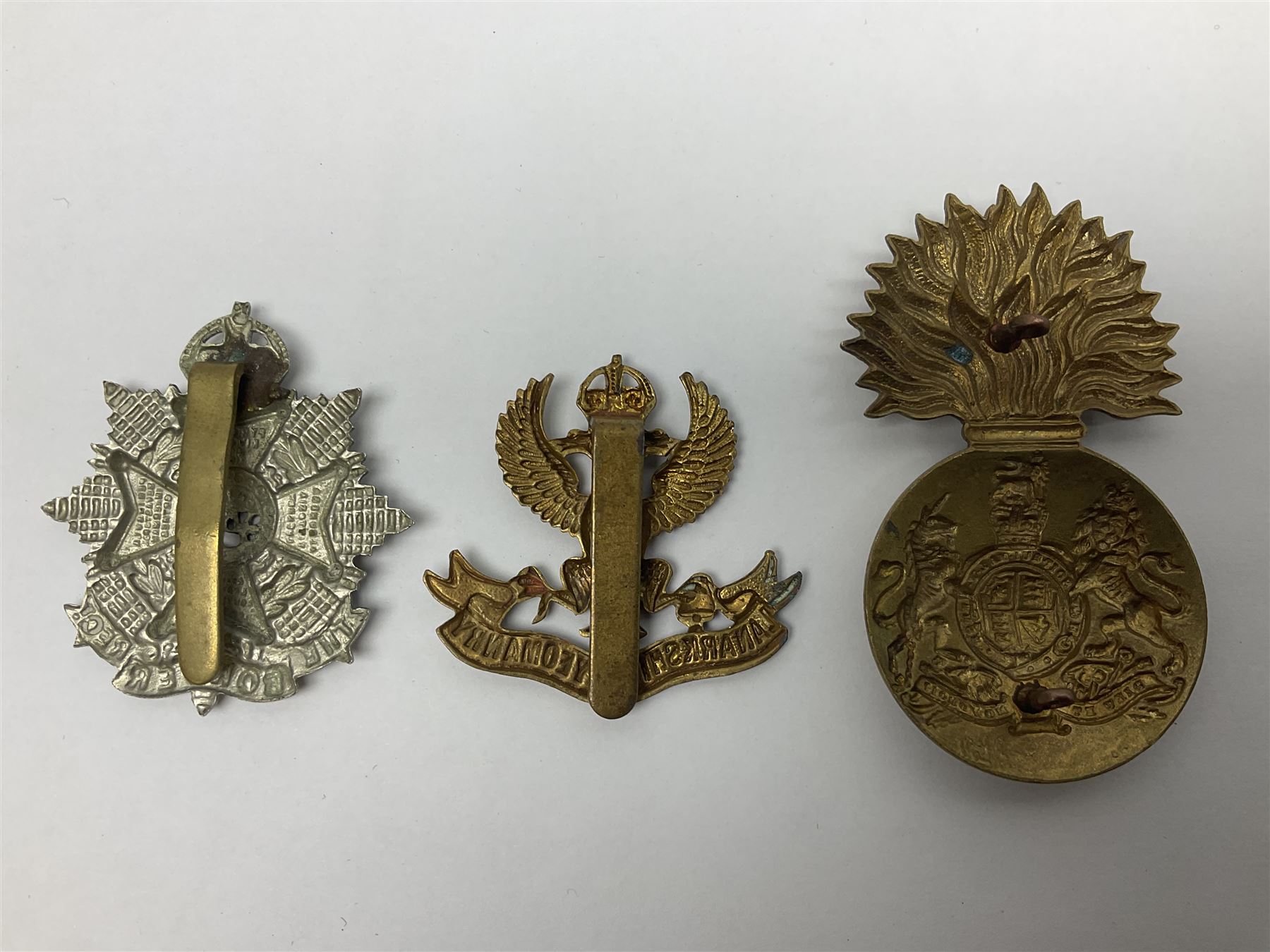 Fifteen Scottish Glengarry and other metal military badges including Argyll & Sutherland, Royal Glasgow Yeomanry, Cameronians, Lanarkshire Yeomanry, Kings Scottish Own Borderers, Highland Light Infantry, Border Regiment, Lowland Regiment, Lothians & Border Horse Yeomanry, Ayrshire Earl of Carricks Own Yeomanry etc