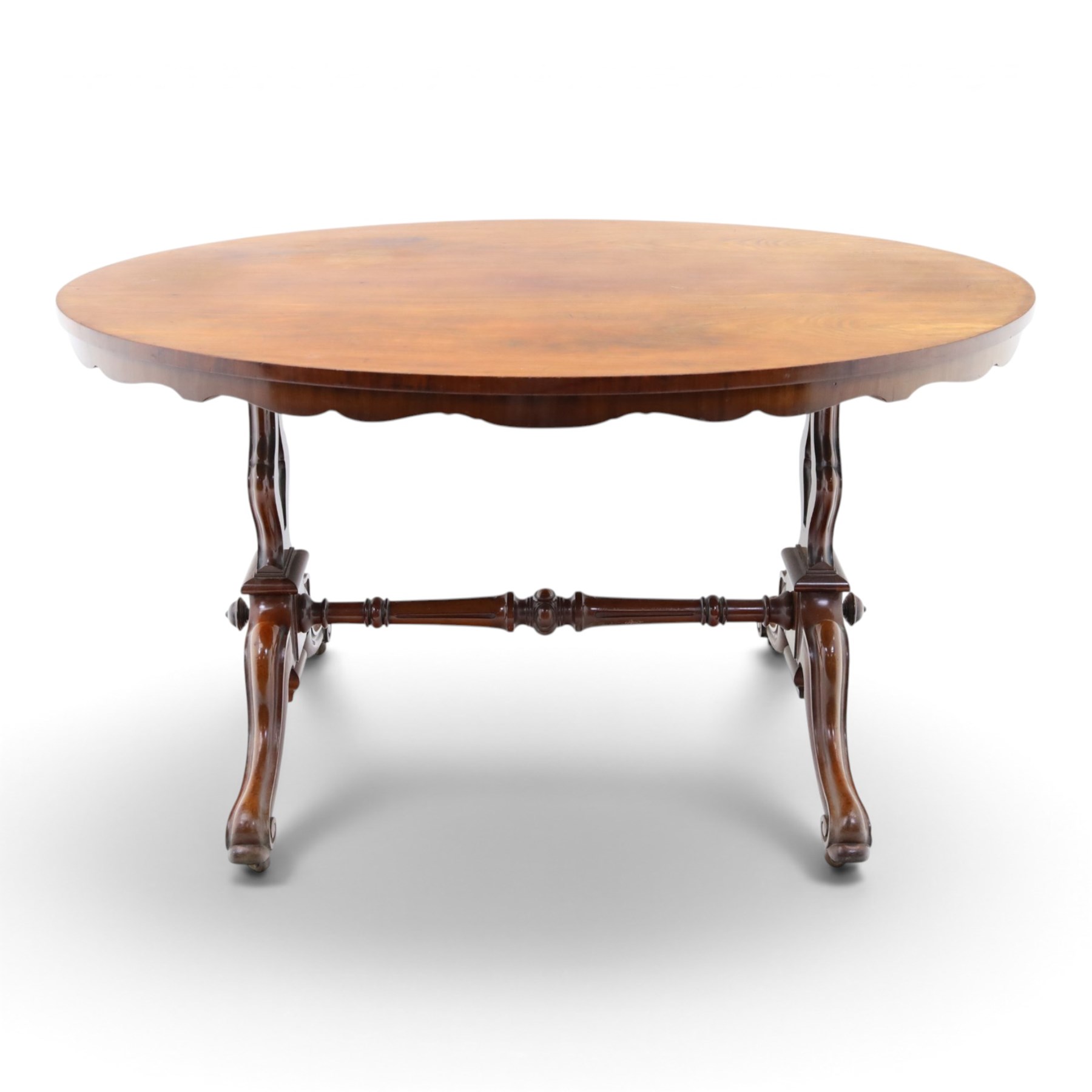 Victorian mahogany breakfast table, oval moulded top over a shaped frieze, on twin pierced lyre-form end supports with moulded scroll feet, united by a turned stretcher, on castors