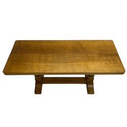 Mouseman - oak coffee table, adzed rectangular top on octagonal supports, on sledge feet united by floor stretcher, carved with mouse signature, by the workshop of Robert Thompson, Kilburn