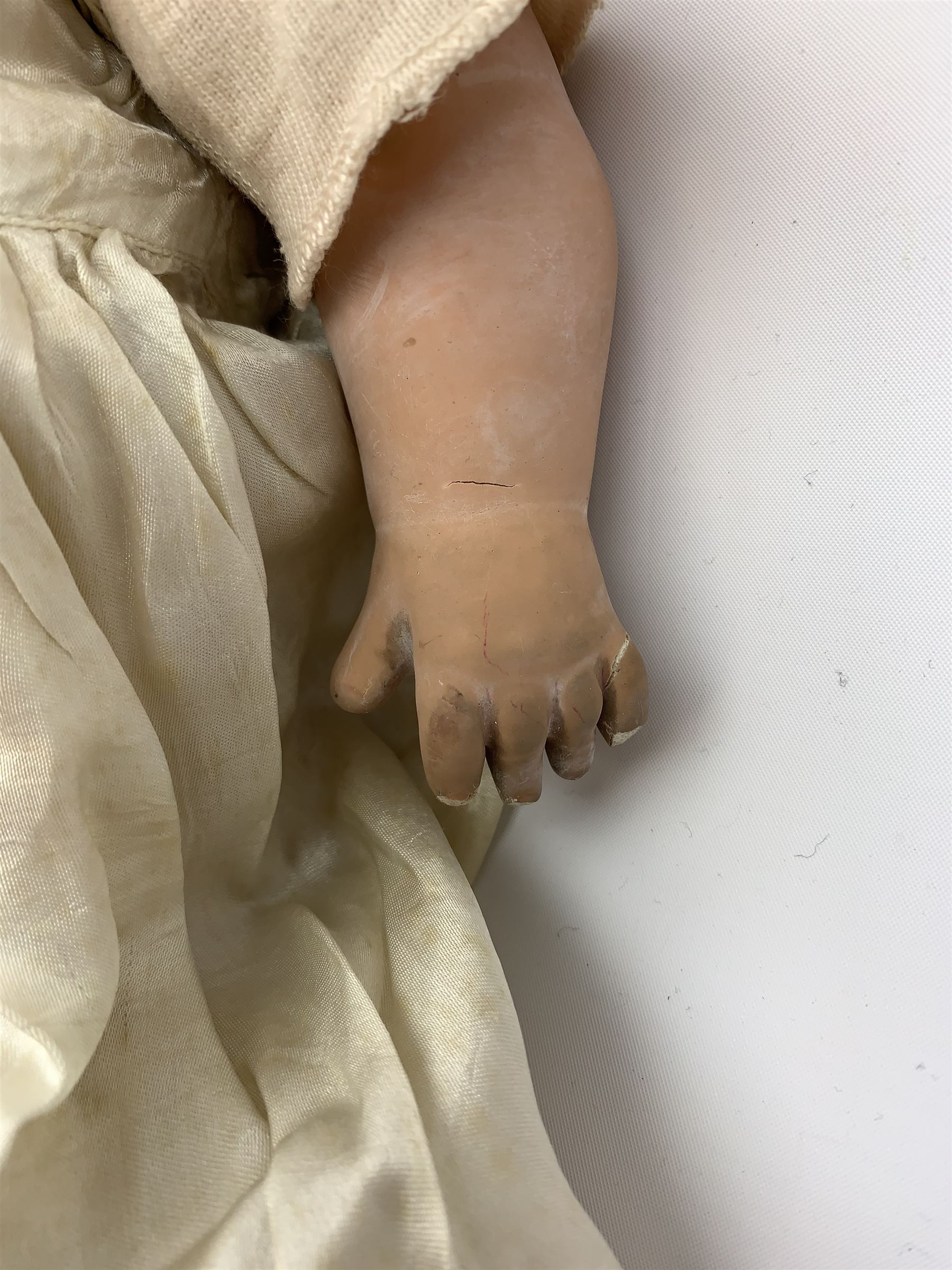 Seyfarth & Reinhardt composition head baby doll with moulded hair, sleeping flirty eyes, open mouth with one tooth and tongue and soft body with composition jointed limbs, marked 'SuR Germany 30/5' H47cm; together with a Golborne Dolls 'Golborne Beauty' composition head and body bride doll, marked 'F.P.23' in original box H63cm (2)