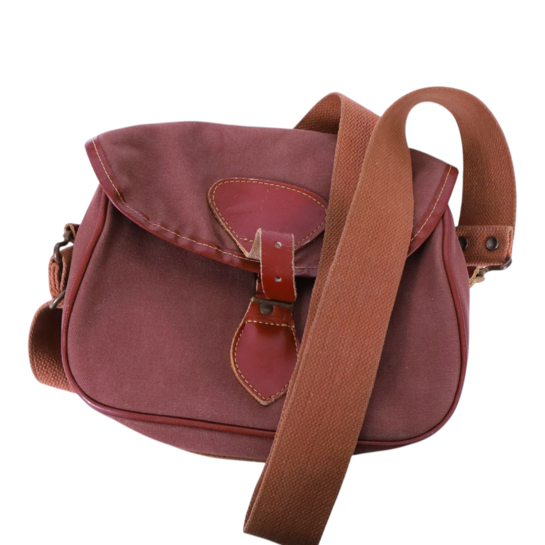 Leather cartridge bag with a canvas strap, together with another cartridge bag, two leather belts etc