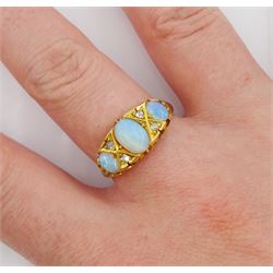 Victorian 18ct gold three stone opal ring, with four diamond accents set between