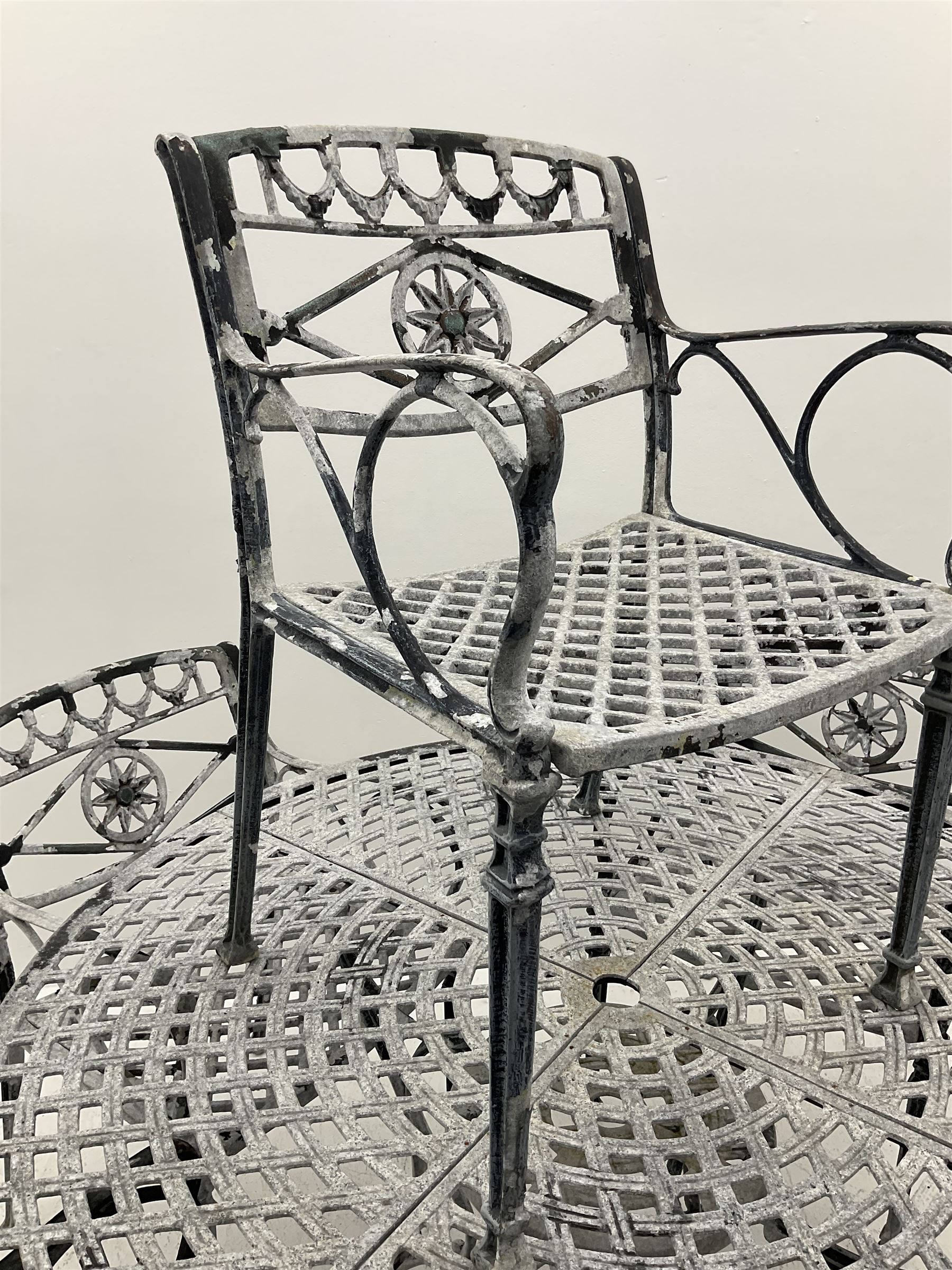 Heavy Aluminium circular garden table, and six wide seat chairs with ‘star’ backs - THIS LOT IS TO BE COLLECTED BY APPOINTMENT FROM DUGGLEBY STORAGE, GREAT HILL, EASTFIELD, SCARBOROUGH, YO11 3TX