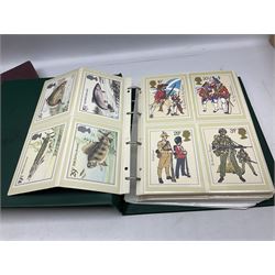 Various Royal Mail PHQ cards, first day covers, World stamps including Poland, Uruguay, Pakistan etc, housed in sixteen albums / folders, in one box