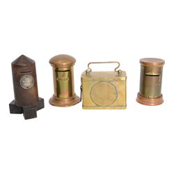 Early 20th century moneyboxes, including trench art example, Bakelite example with applied West Africa Two Shilling coin engraved 'Joan', three brass pot boxes and a wooden ebonised example with brass mounts, tallest H15cm