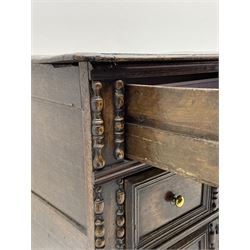 18th century oak chest, moulded rectangular top over three drawers, the front decorated with split mouldings, on turned bun feet