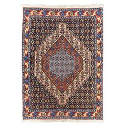 Persian Bijar prayer rug, dark brown ground with all-over Herati design surrounding a rust...