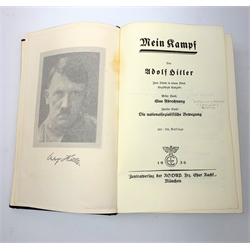 WW2 Kreigsmarine uniform accessories from prisoner of war U-boat Kapitanleutnant Gunther Lorenz comprising cap badge, pair of epaulettes, thirteen buttons marked 1940 and roll of rank braiding and stars; together with copy of Adolf Hitler's Mein Kampf. 1936 published by Zentralverlag Der NSDAP Munchen with German text.