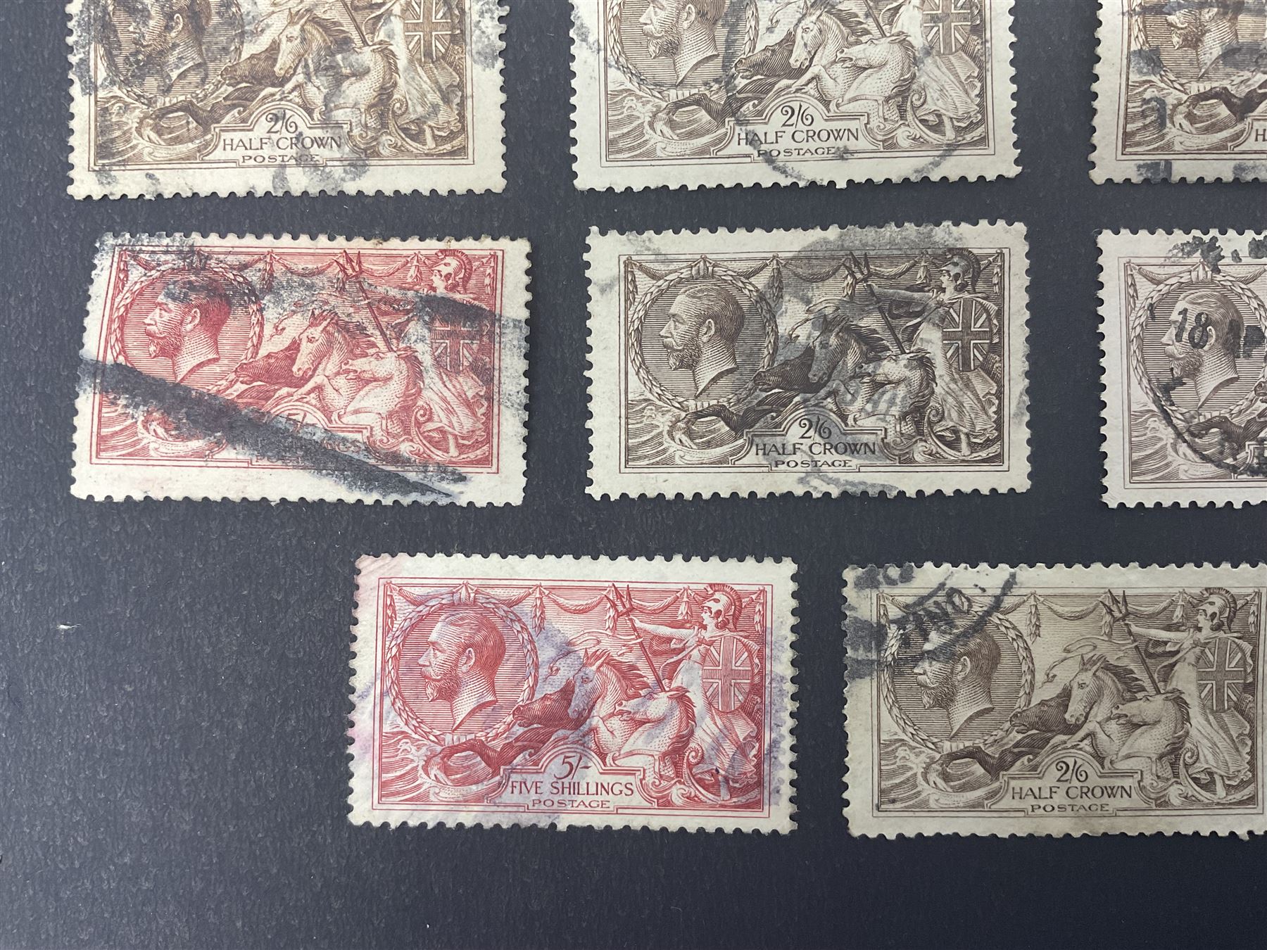 Great Britain King George V seahorse stamps, comprising fourteen half crown, seven five shillings and two ten shillings, all used, all previously mounted