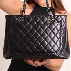 Chanel - black GST Grand Shopping Tote, caviar leather with classic diamond quilting and large embroidered CC logo to the centre front, with polished silver-tone hardware, a rear patch pocket, chain and leather handles, and an open top with three main interior compartments, 2009-2010, serial number 13547470