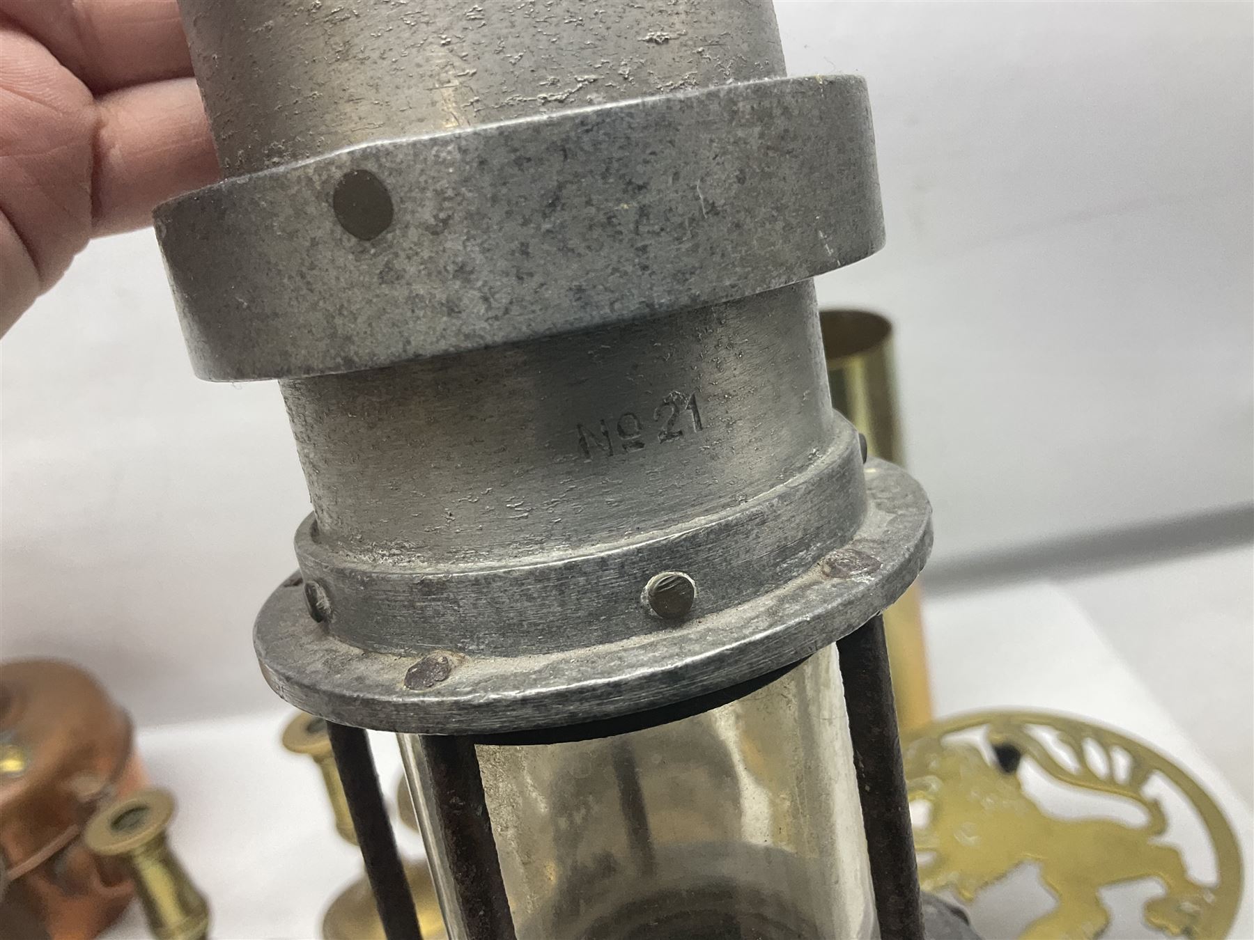 Collection of brassware, to include two jardinieres, candle sticks, brass shell, etc