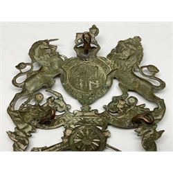 Artillery helmet plate, king's crown crest, the bottom ribbon marked 'Volunteer Artillery' with three fixing eyes verso H9.5cm