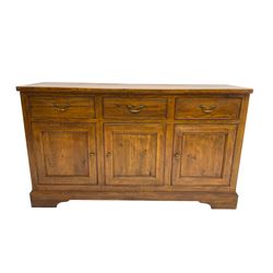 Willis & Gambier - oak sideboard, three drawers over three panelled cupboards, on bracket feet 