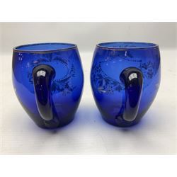 Pair of Victorian cobalt blue glass cups with gilt and painted decoration, entitled Hope's the Balm of Life and Love me as I Love Thee, H8.5cm