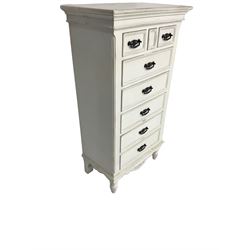 Tall white finish chest, fitted with three small drawers over five long drawers, on turned feet