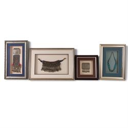 Four framed pieces of jewellery, including tribal coin and blue stone choker, multi stand ...