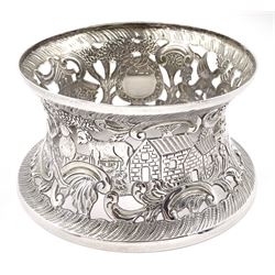 Edwardian Irish silver dish ring, of circular waisted form, embossed and pierced throughout with scene of figures, birds, cattle and buildings amidst C scrolls, hallmarked James Wakely & Frank Clarke Wheeler, Dublin 1906, upper rim D10cm, approximate weight 4.11 ozt (128 grams)