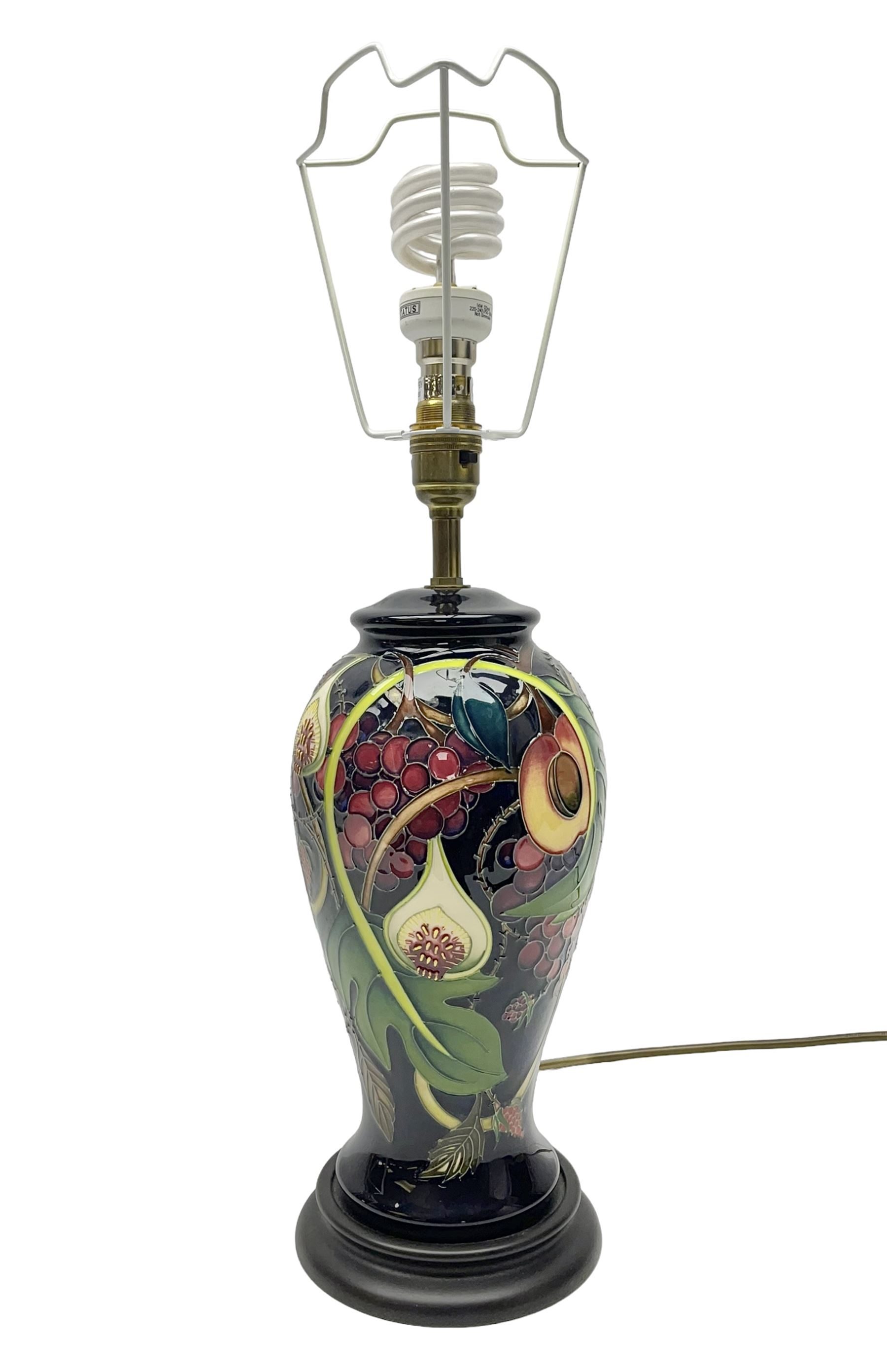 Moorcroft table lamp of baluster form, decorated in the Queens Choice pattern by Emma Bossons, H49cm
