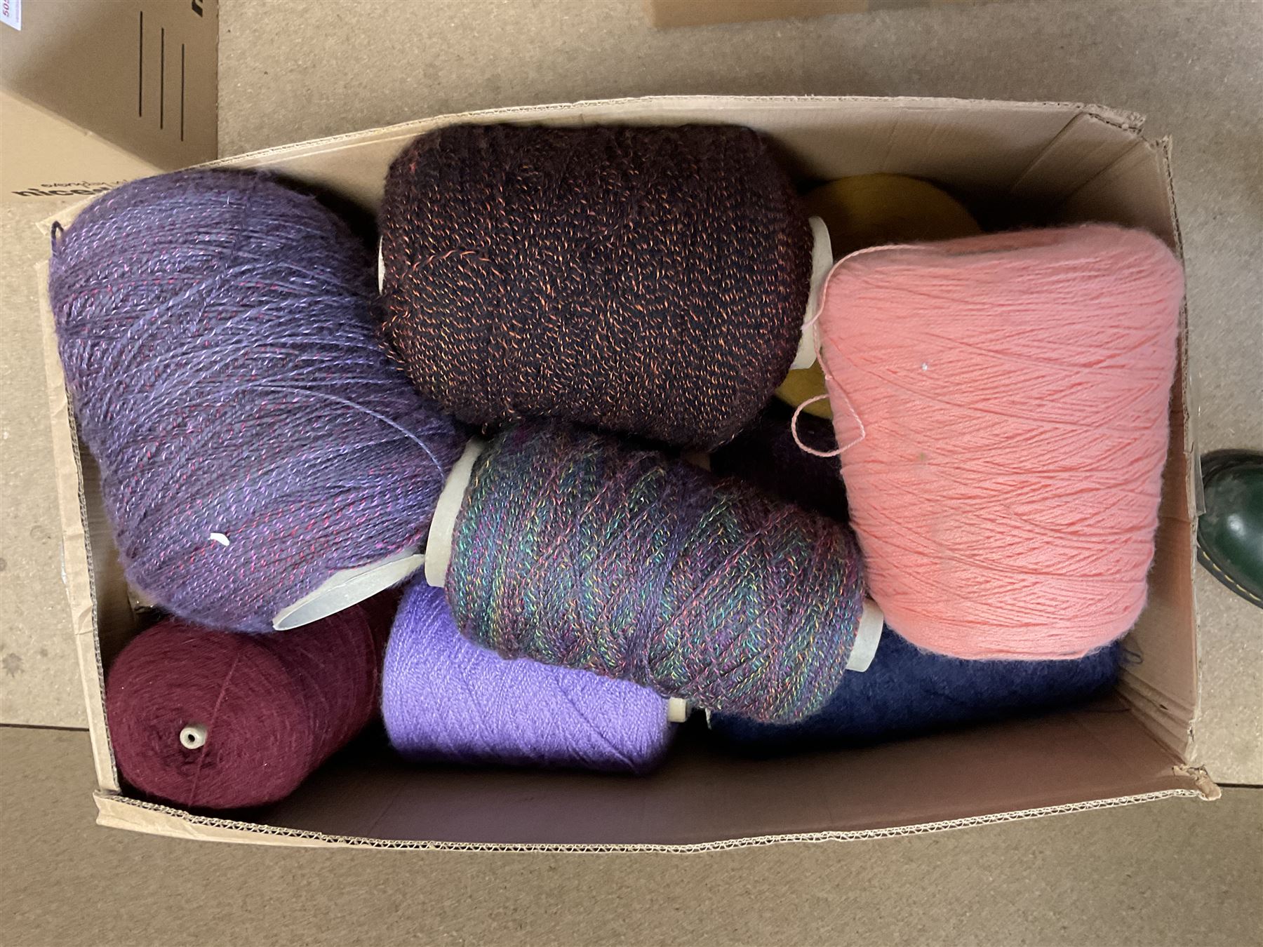  Brother cased knitting machine model KH-890 together with Brother Ribbing attachment model KH-850, knitting machine yarn cones in assorted colours, selection of knitting patterns etc