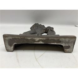 Cast iron door stop, in the form of a rampant lion on elaborate stepped plinth base, H38cm