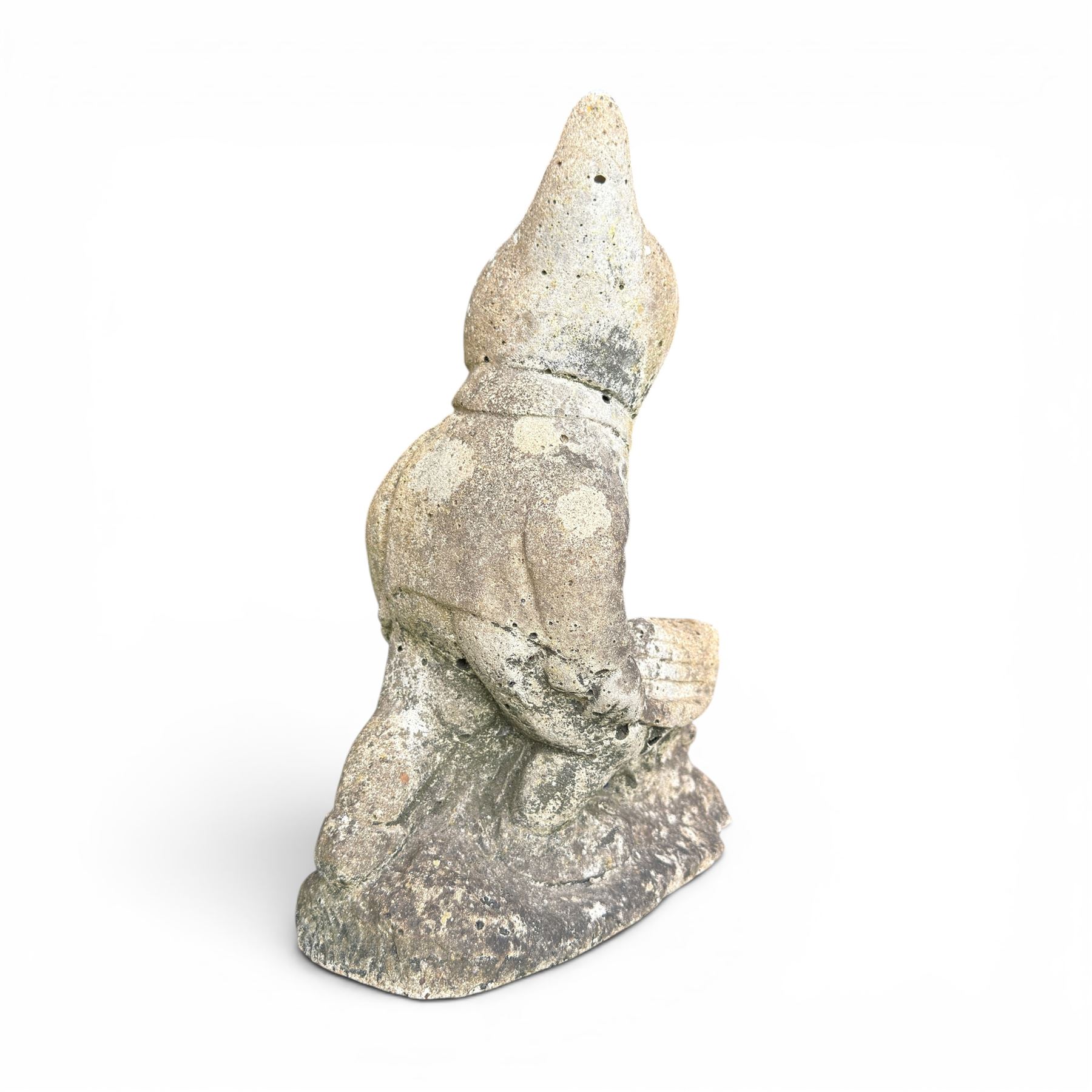 Two seated cast stone garden gnomes