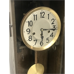 Early 20th century oak cased wall clock, circular silvered Arabic dial, enclosed by bevel glass paneled door, triple train driven quarter Westminster chiming movement, H73cm (with pendulum)