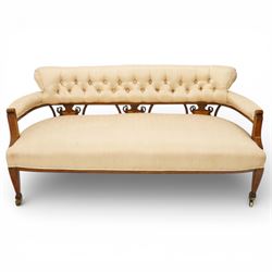 Edwardian inlaid mahogany sofa, upholstered in cream fabric with buttoned back rail, taper...