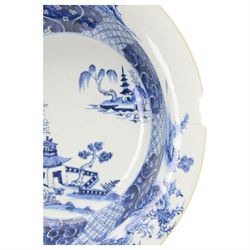 Large 19th century Chinese export blue and white bowl, of circular form, the dished centre decorated with pagodas, fence, and pine and willow trees, within a cell border with flower head and scroll detailed shaped reserves, the rim with conforming decoration of huts and trees, D39.5cm