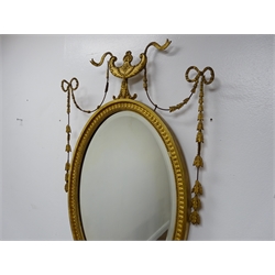  Pair of Edwardian Adam Revival carved gilt wood and gesso wall mirrors, oval bevelled plates with ribbon tied, urn and harebell cresting, H83cm, W49cm (2)  