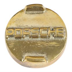 Metal petrol can in the style of Porsche, with black painted body, hand-painted Porsche logo detailing and gilt screw lid