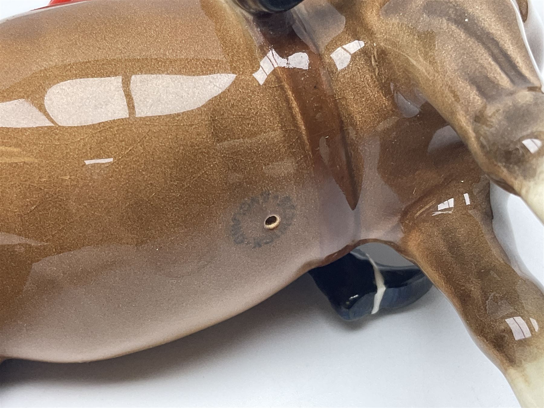 Beswick huntsman upon a bay horse no. 1501, with printed mark beneath, H22cm