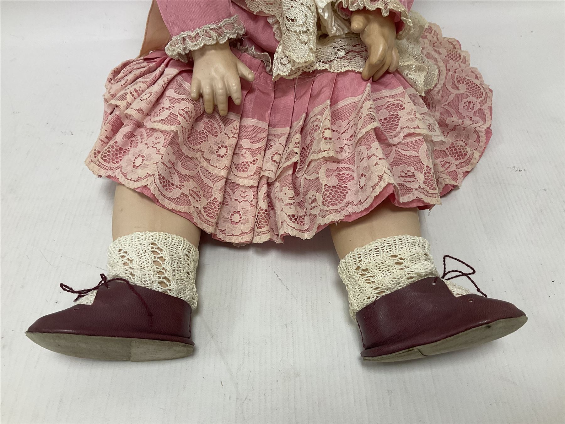 Reproduction Simon & Halbig bisque head doll with applied hair and jointed limbs; marked Simon & Halbig 117, H58cm